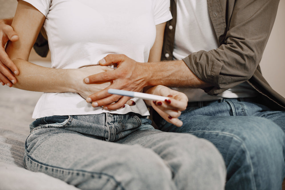 new parents finding out about baby with pregnancy test kit