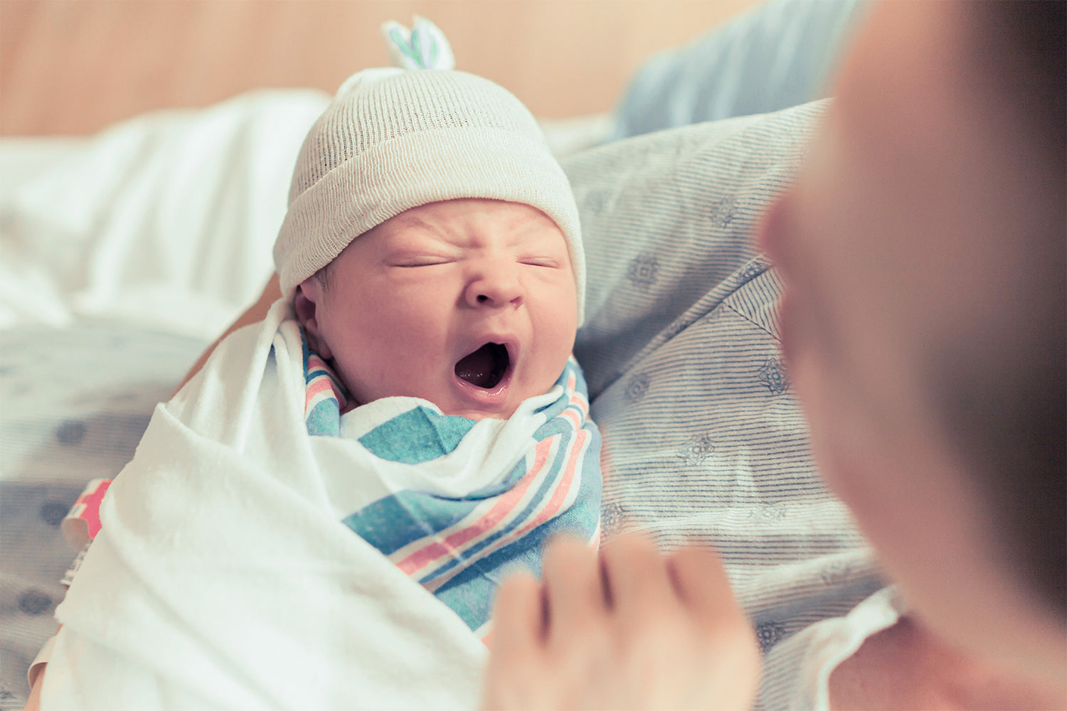 mother carrying a newborn baby