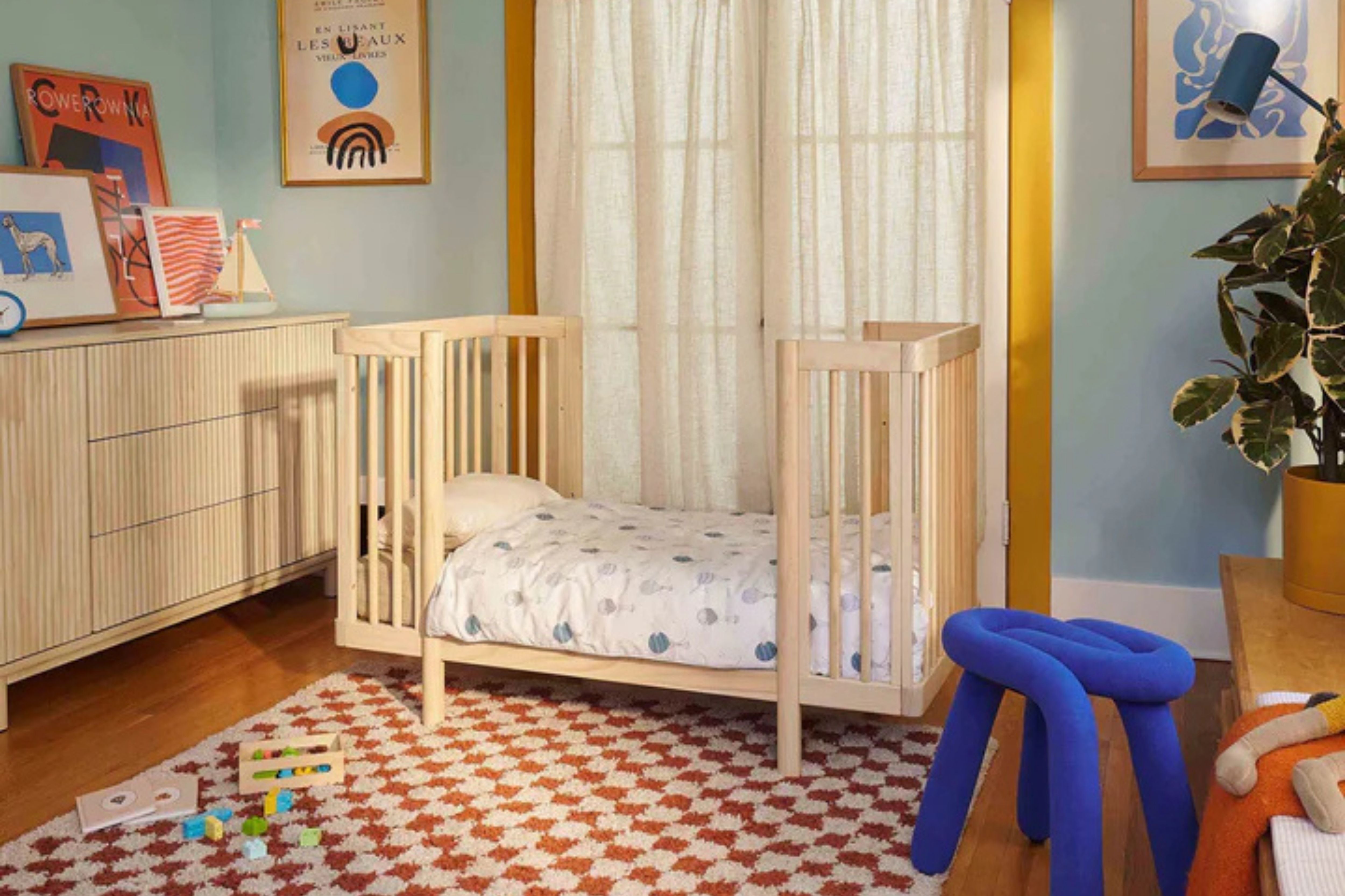 Babyletto blonde pogo 8-in-1-convertible crib junior bed configuration in a nursery#color_blonde