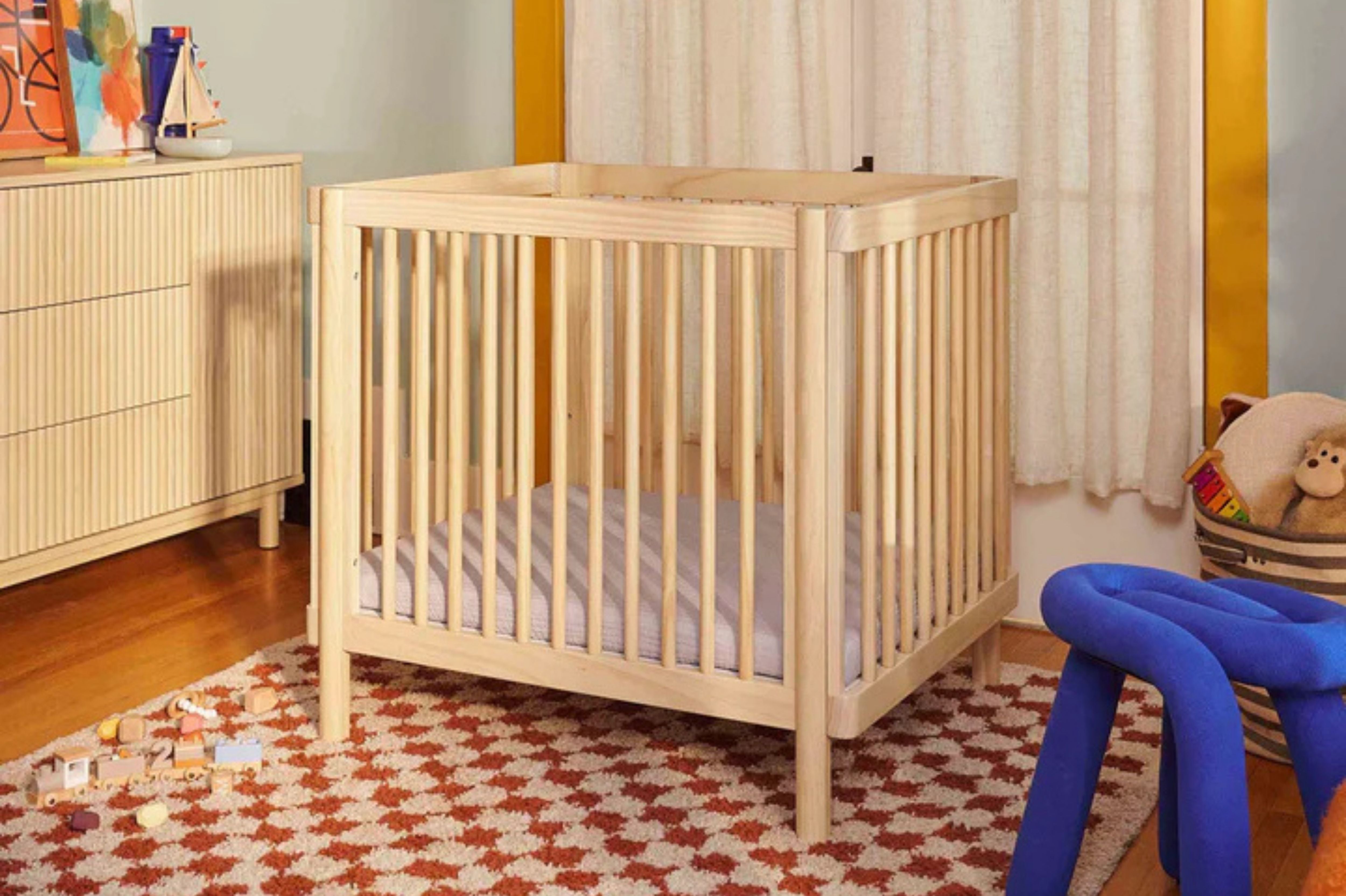 Babyletto blonde pogo 8-in-1-convertible crib midi configuration in a nursery#color_blonde