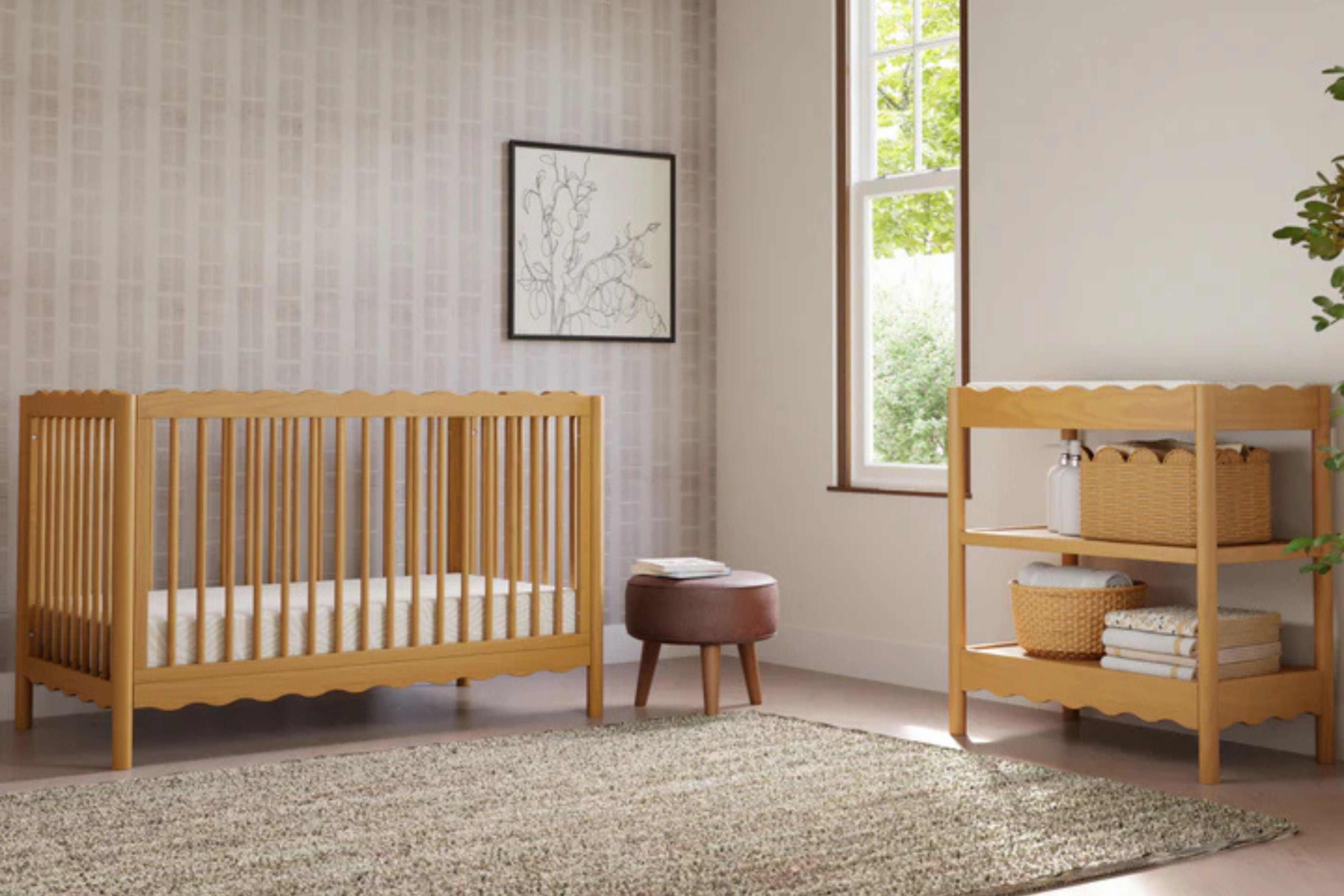 Babyletto swell changing table honey paired with the matching swell convertible crib in the nursery#color_honey