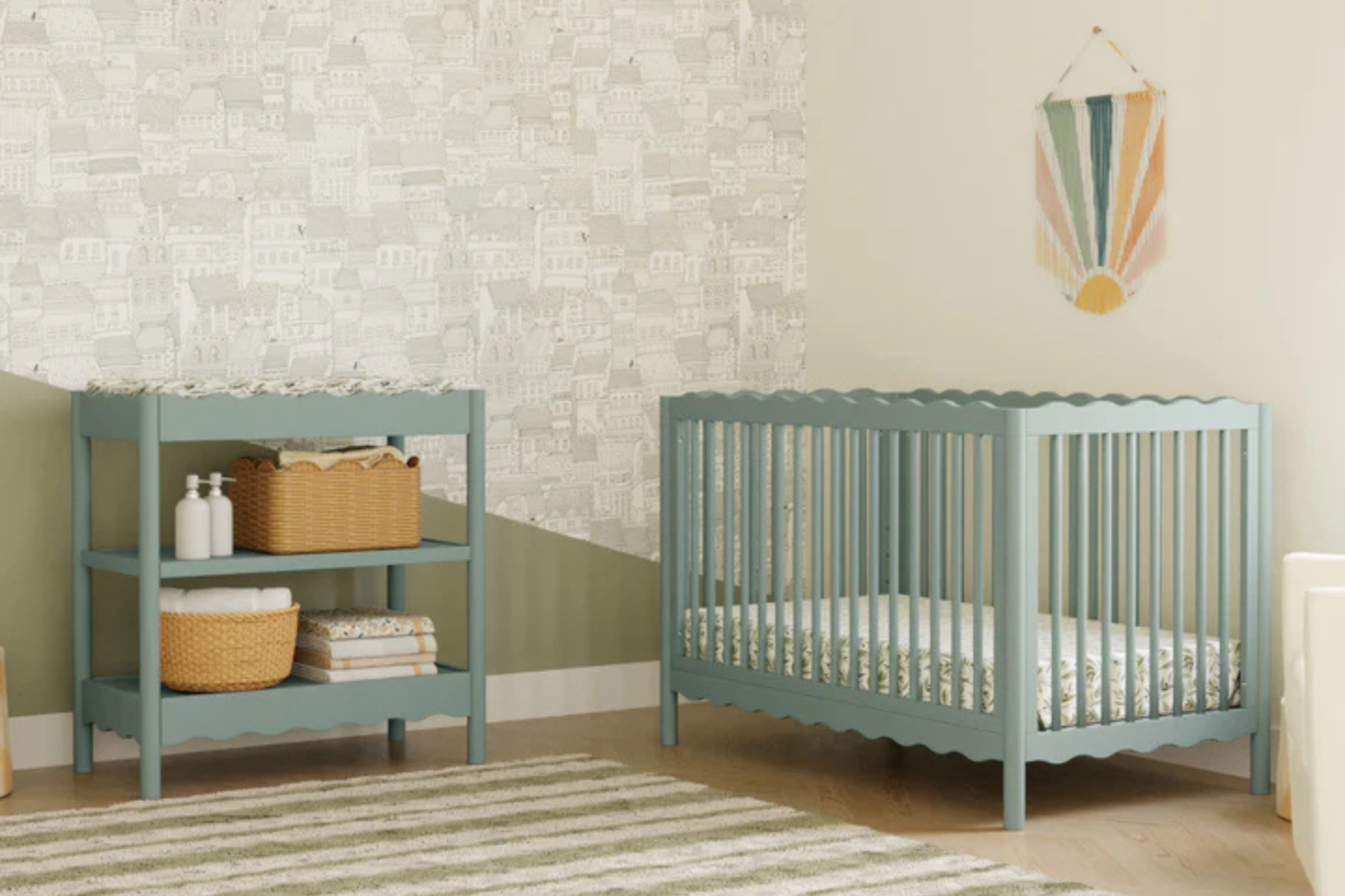 Babyletto swell changing table light sage paired with the matching swell convertible crib in the nursery#color_light-sage