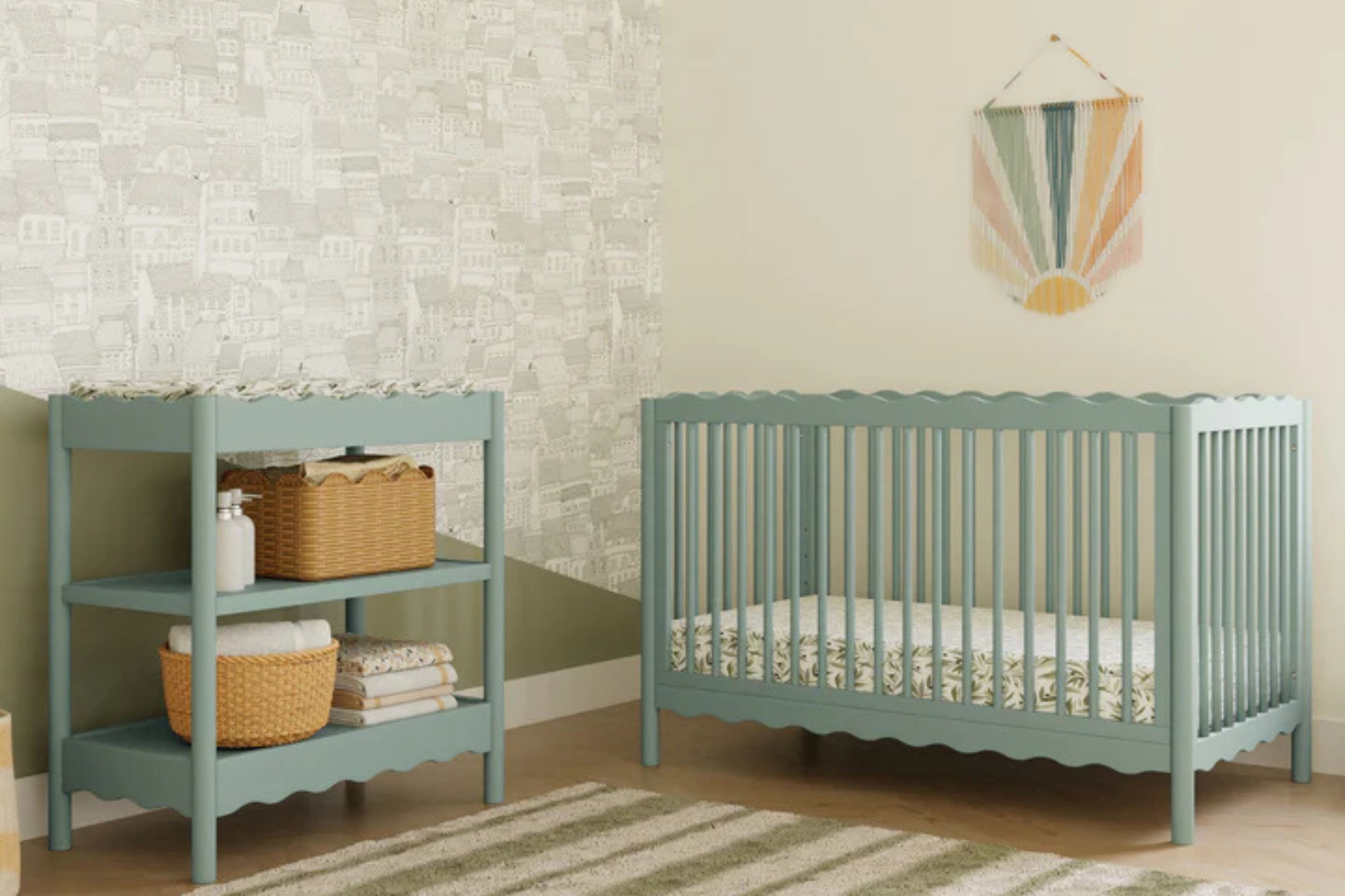 babyletto swell convertible crib light sage in a nursery with the matching swell changing table#color_light-sage