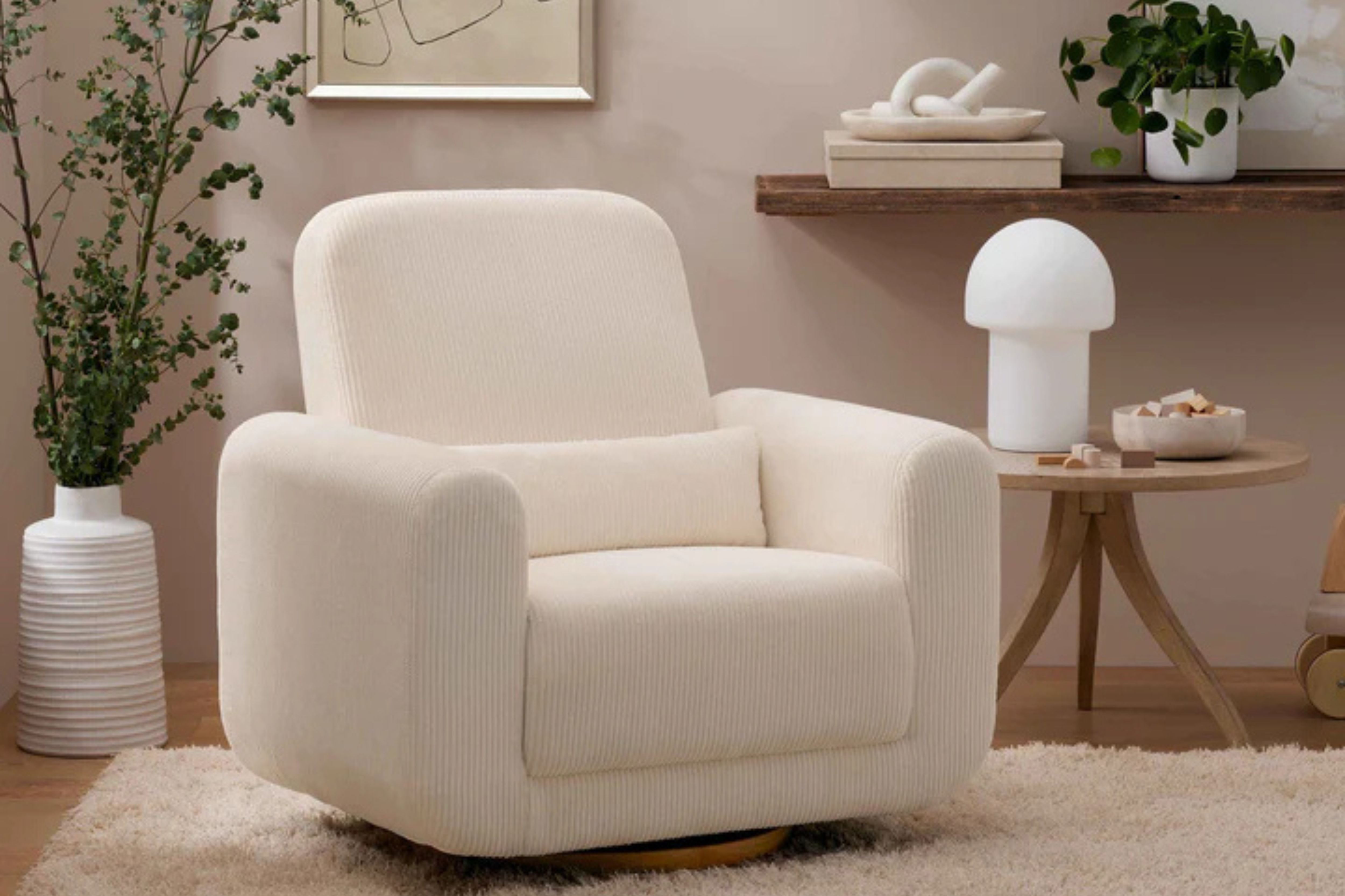 babyletto tuba nursing chair in the corner of a nursery#color_luxe-fabric-ivory-corduroy