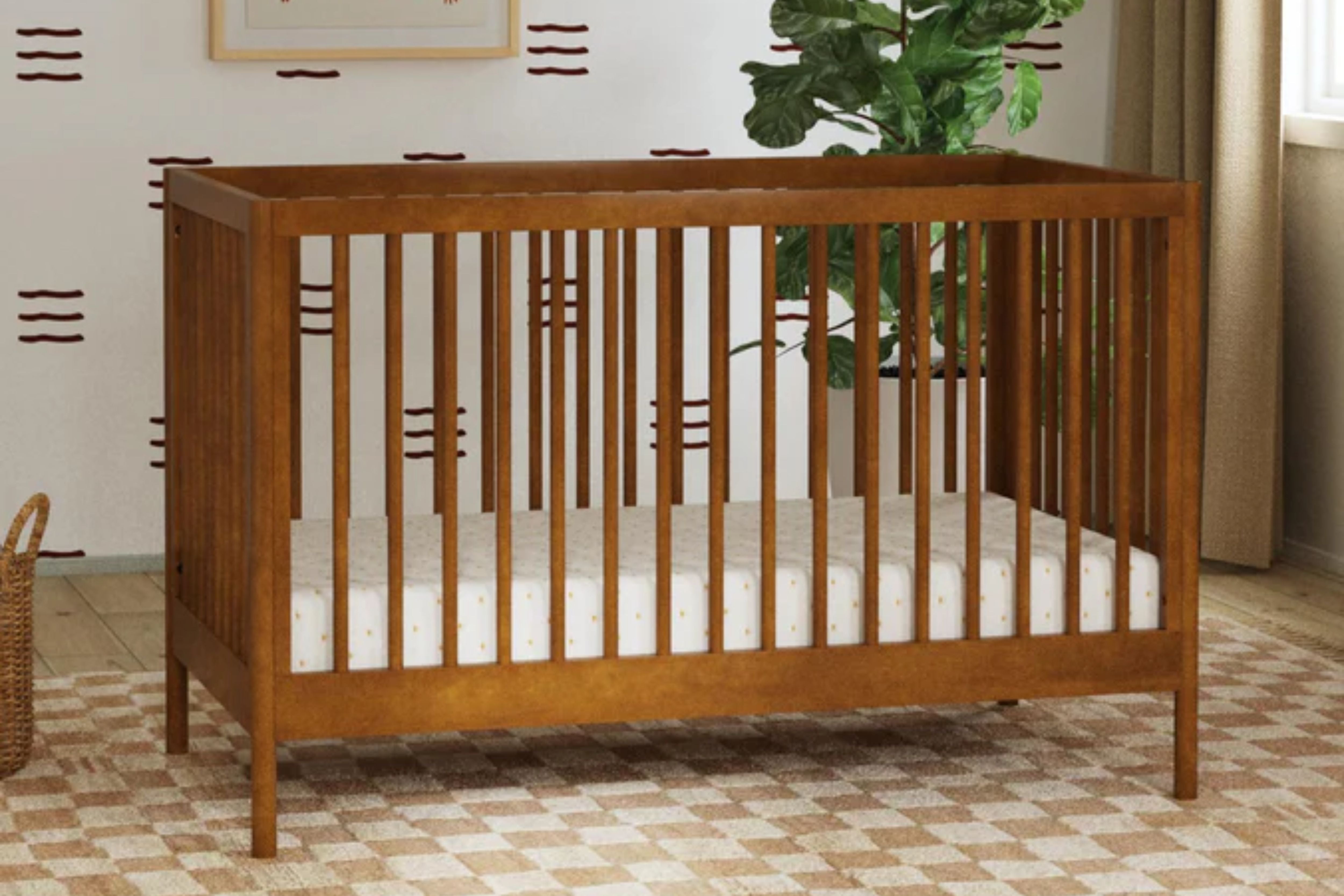 DaVinci Birdie 3-in-1 Convertible Crib displayed in a nursery#color_walnut