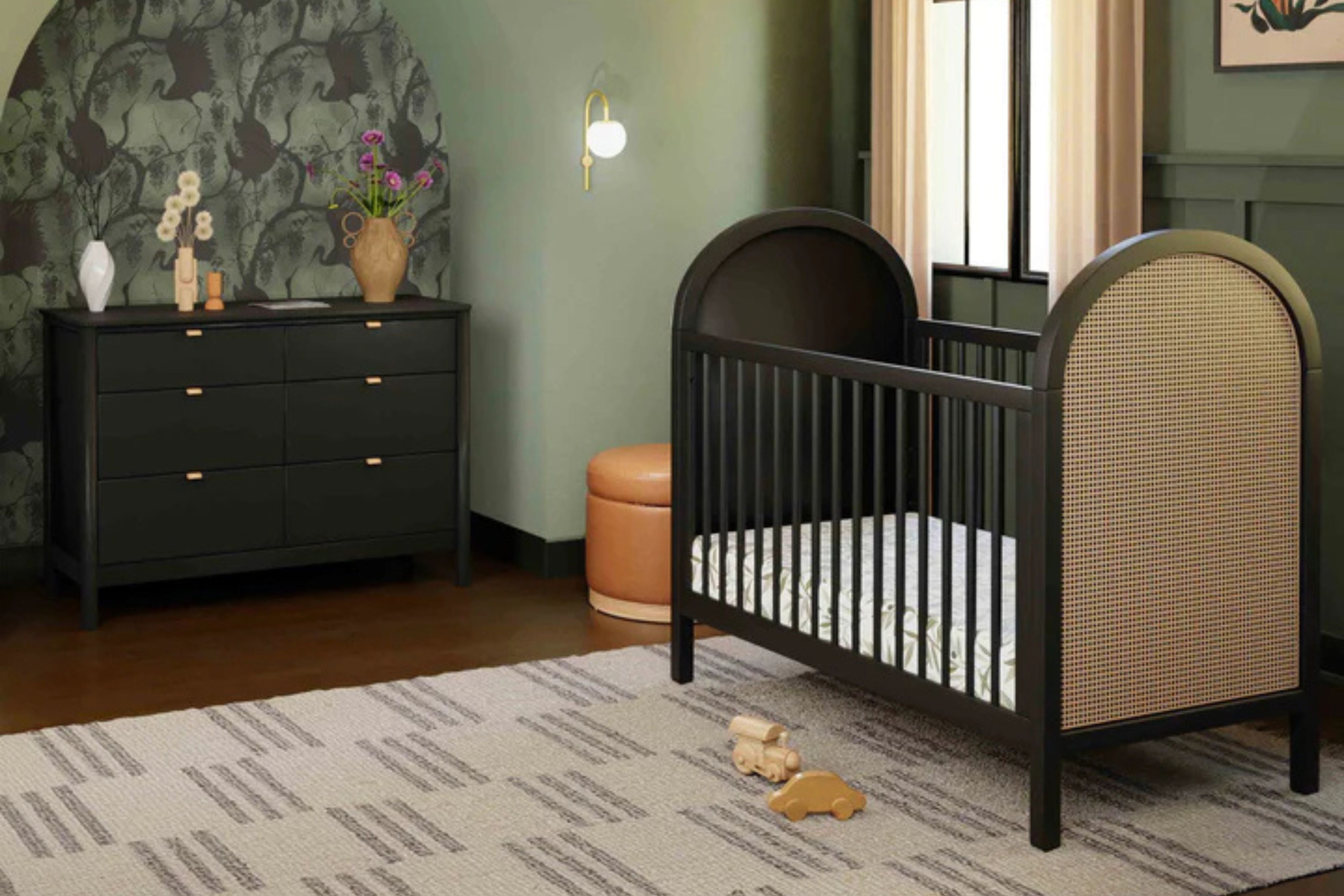  Babyletto Bondi Convertible Crib In Black with natural cane displayed in a nursery#color_black-with-natural-cane