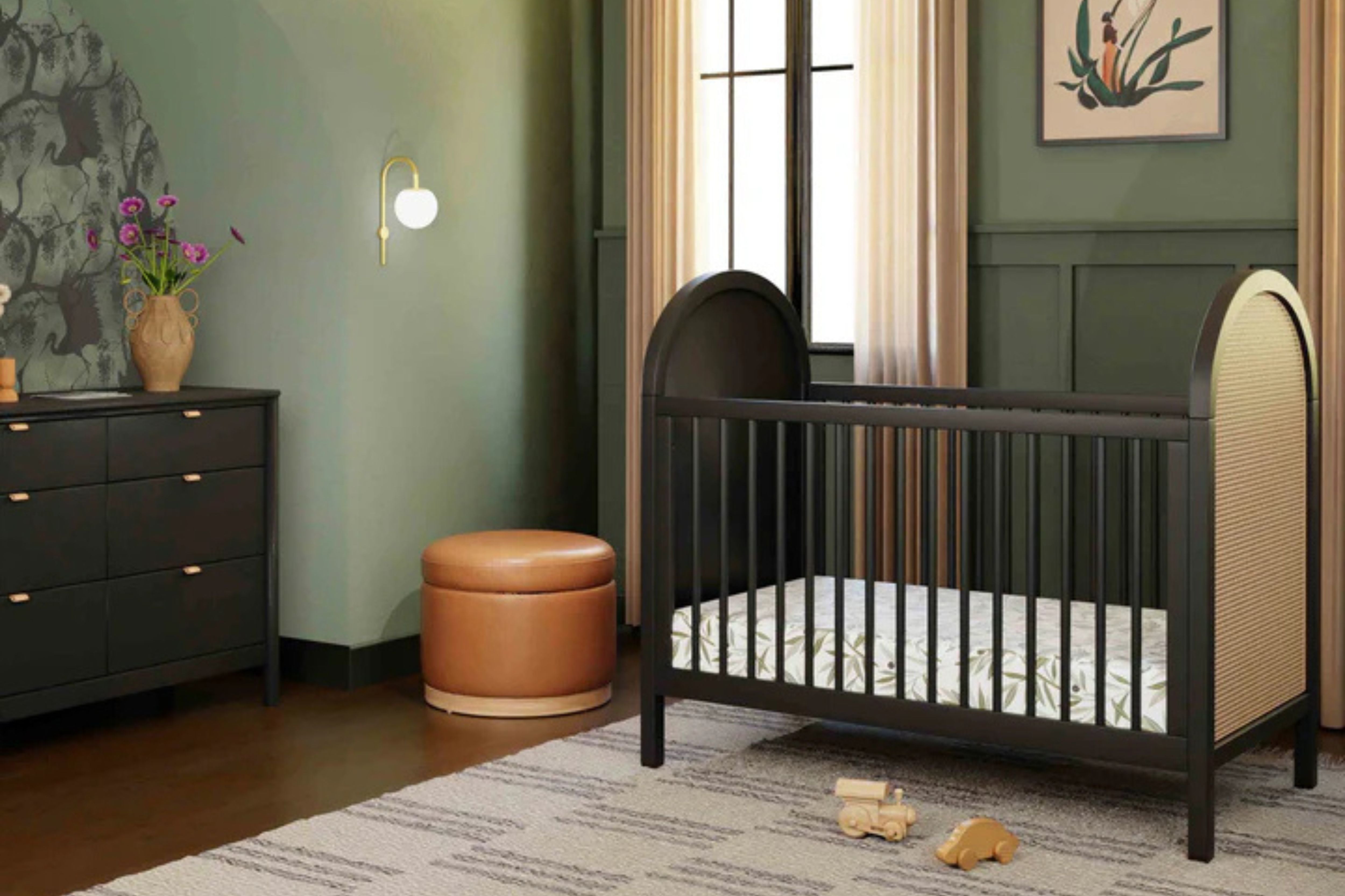  Babyletto Bondi Convertible Crib In Black with natural cane displayed in a nursery#color_black-with-natural-cane