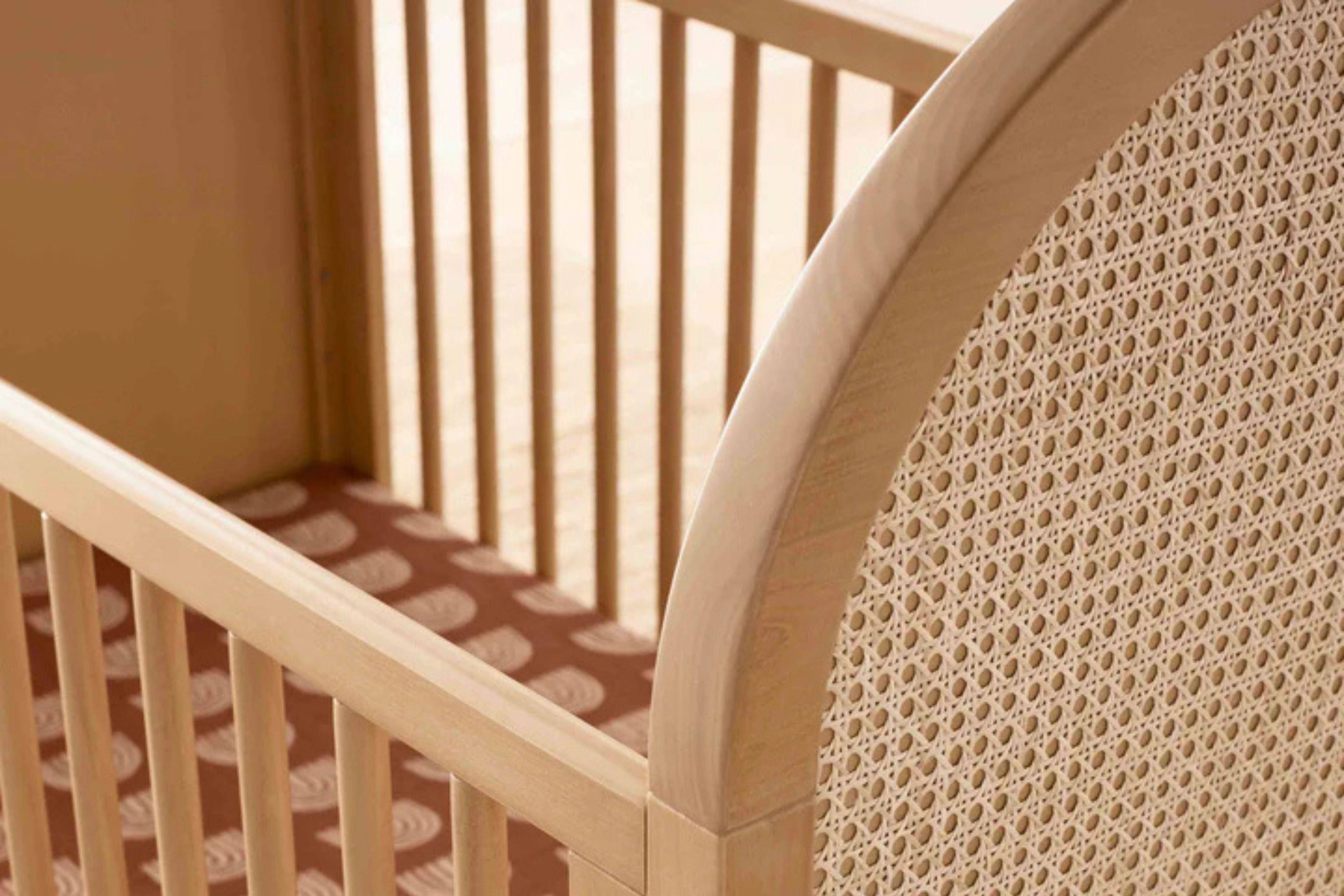 Babyletto Bondi Convertible Crib In Honey with natural cane texture details#color_honey-with-natural-cane