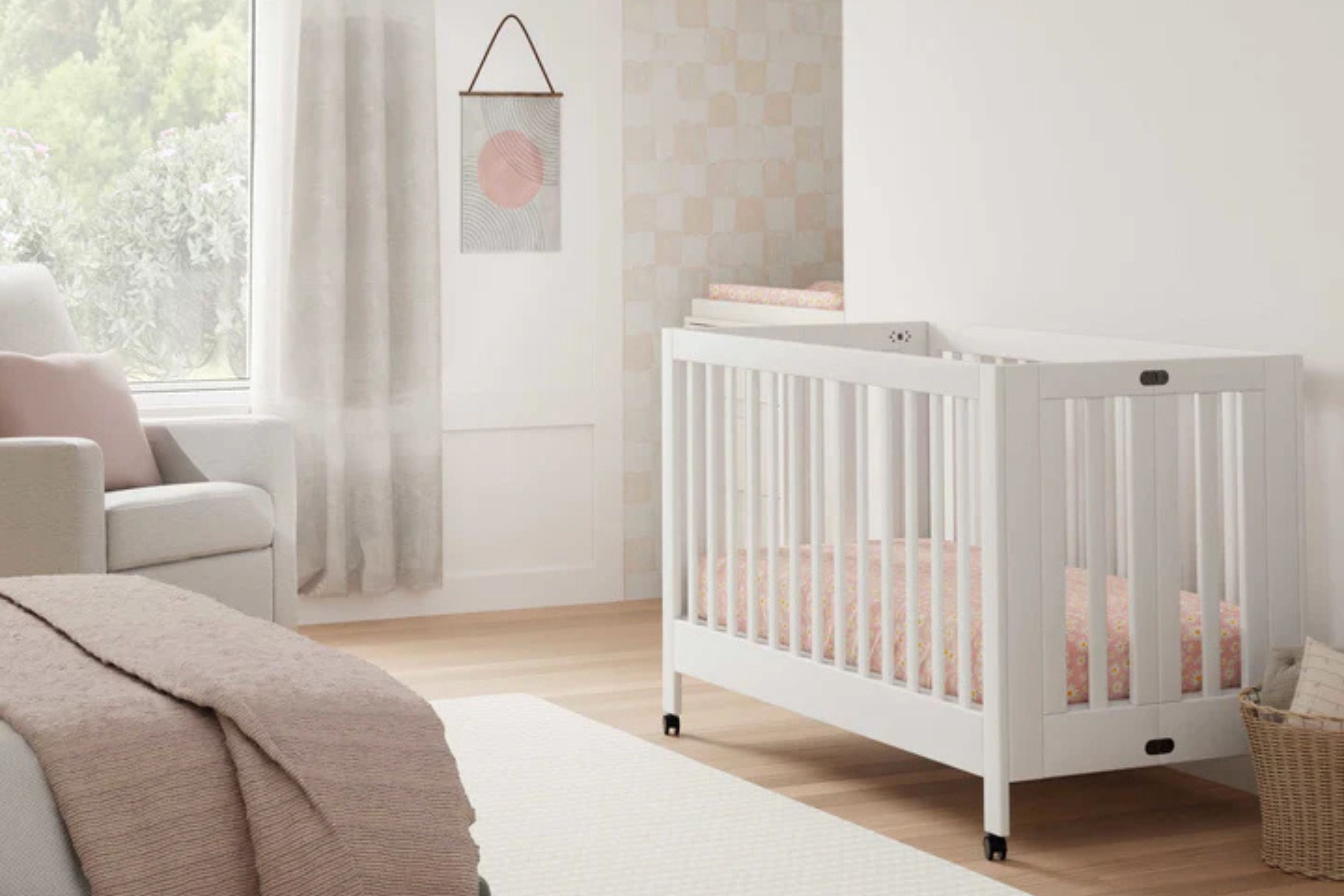 Babyletto Maki 3-in-1 Convertible Crib White displayed in a nursery#color_white