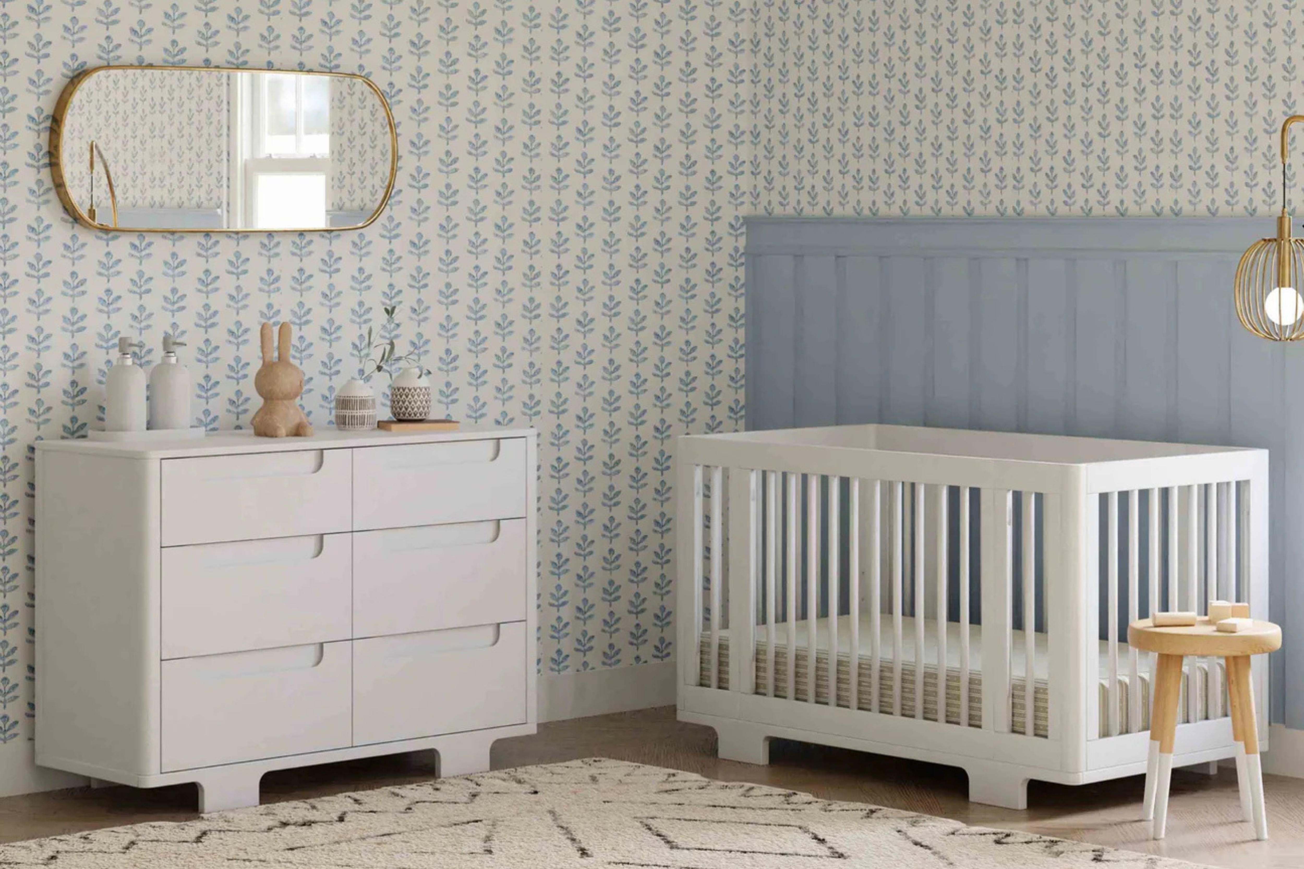 Babyletto Yuzu 8-in-1 Convertible Crib White in a nursery with the matching Yuzu dresser in white#color_white